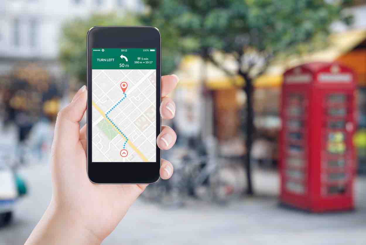 Map gps navigation application on the smartphone screen in female hand