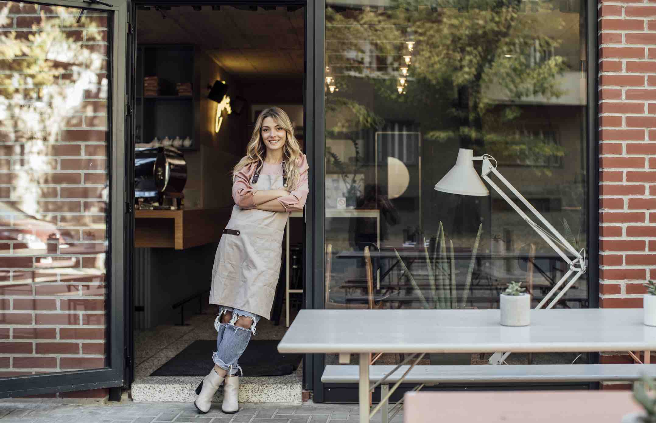 Waitress Standing on Cafe Doors