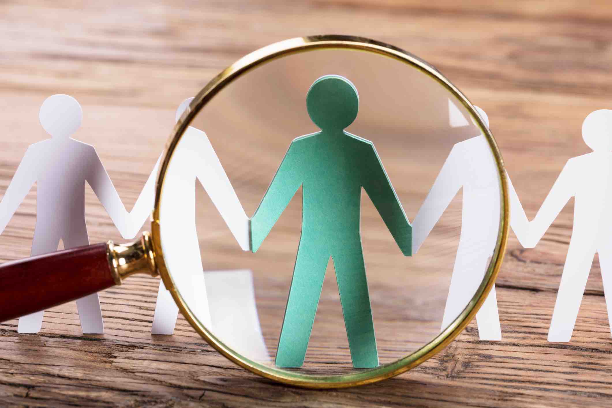 Magnifying Glass On Cut-out Figures