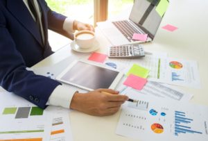 Concept Of A Business Man Analyzes Data Online Wit PNWSCD9 300x203