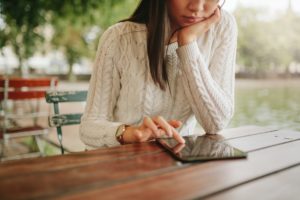 Woman Browsing Website Pages On Touch Pad PNGQAFE